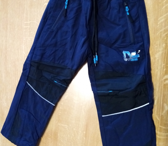 Kalhoty chlapecké teplé šusťákové podšité fleecem s bagrem modré 98-128